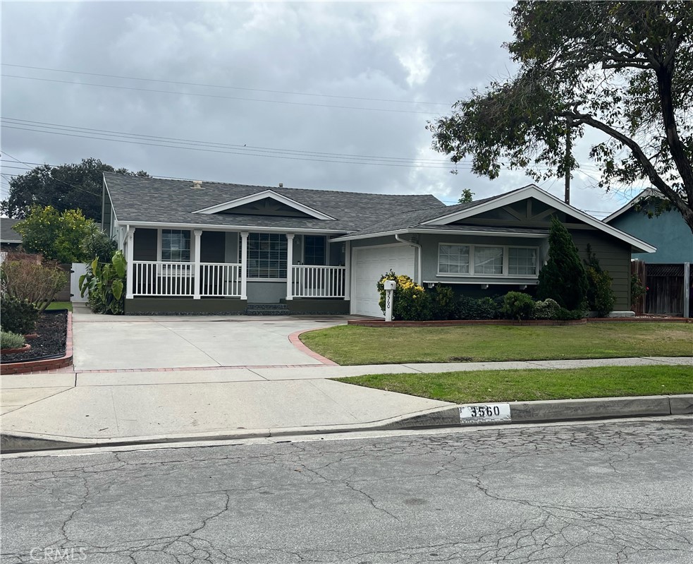 3560 Ely Avenue Long Beach, CA 90808 - Photo 1 of 1 a front view of a house with a garden