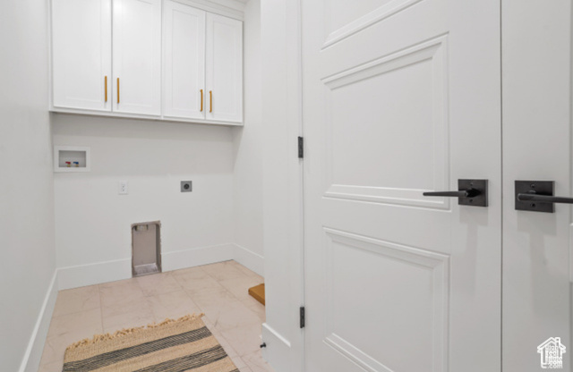 599 North Heritage Street, Unit 6 Mapleton, UT 84664 - Photo 29 of 37 Washroom featuring electric dryer hookup, washer hookup, light tile patterned floors, and cabinets