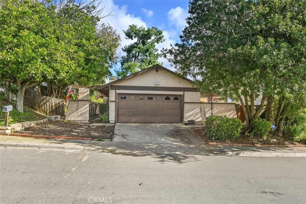 a house with a yard and large trees