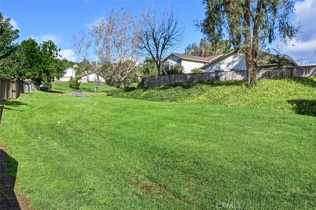 2202 Village Road Escondido, CA 92026 - Photo 15 of 15 a view of a backyard with large trees