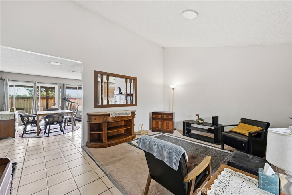 2202 Village Road Escondido, CA 92026 - Photo 3 of 15 a bedroom with furniture and a piano