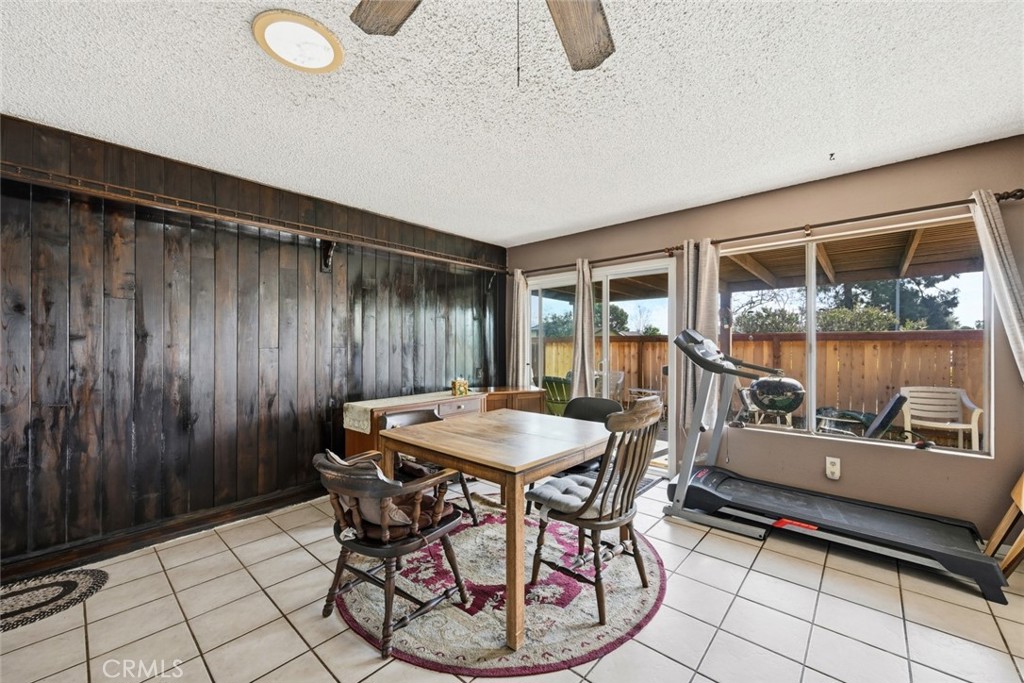2202 Village Road Escondido, CA 92026 - Photo 6 of 15 a dining room with furniture and a floor to ceiling window