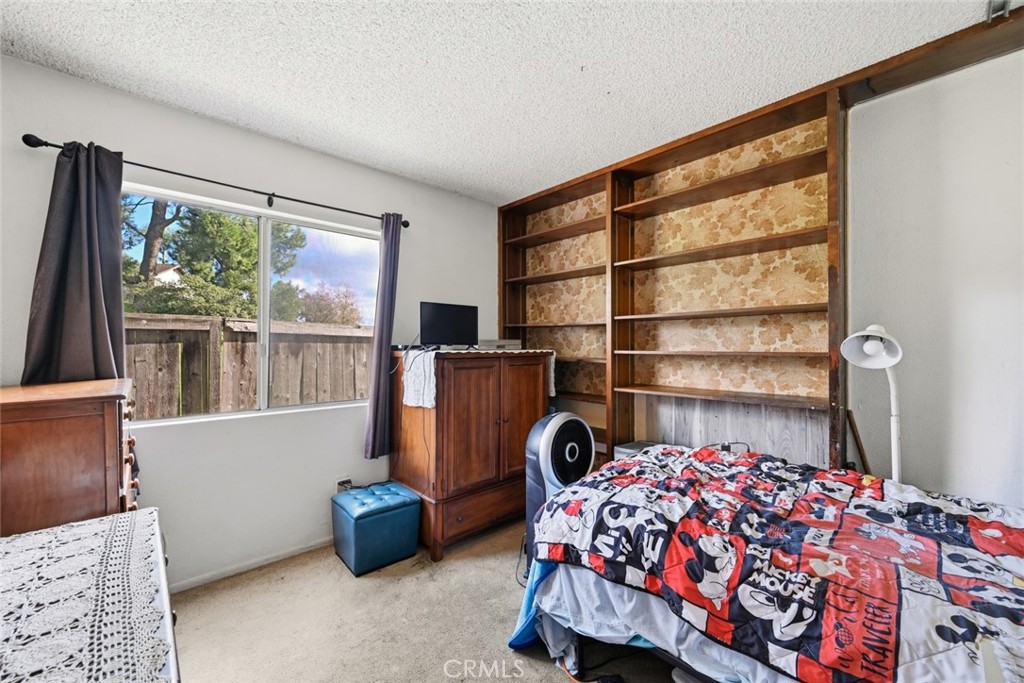 2202 Village Road Escondido, CA 92026 - Photo 8 of 15 a bedroom with a bed and a window