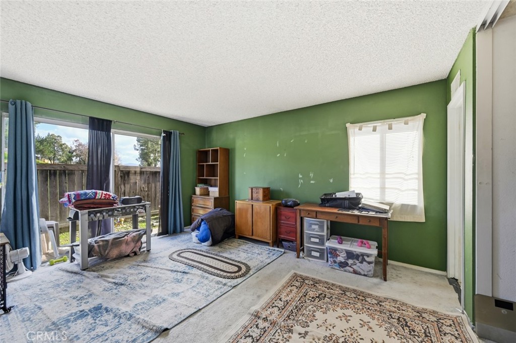 2202 Village Road Escondido, CA 92026 - Photo 9 of 15 a living room with furniture and a window