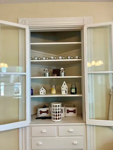 a kitchen with granite countertop a sink and cabinets