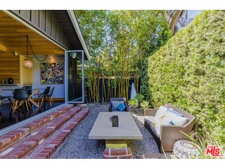 swimming pool view with a seating space