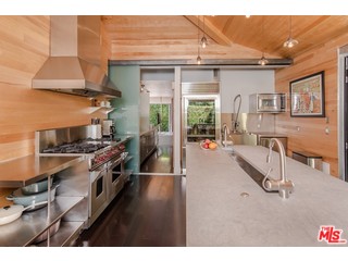433 Sycamore Road Santa Monica, CA 90402 - Photo 11 of 28 a open kitchen with stainless steel appliances granite countertop a stove and a refrigerator