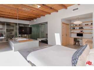 433 Sycamore Road Santa Monica, CA 90402 - Photo 19 of 28 a bedroom with a bed a lamp and window