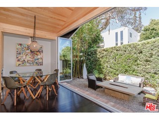 433 Sycamore Road Santa Monica, CA 90402 - Photo 4 of 28 a view of a dining table and chairs in patio