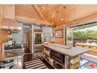 433 Sycamore Road Santa Monica, CA 90402 - Photo 7 of 28 a kitchen with kitchen island a stove and a sink