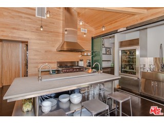 433 Sycamore Road Santa Monica, CA 90402 - Photo 9 of 28 a kitchen with a stove a sink and a refrigerator