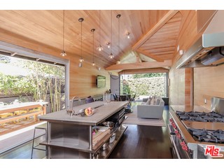 433 Sycamore Road Santa Monica, CA 90402 - Photo 10 of 28 a living room with furniture and a large window