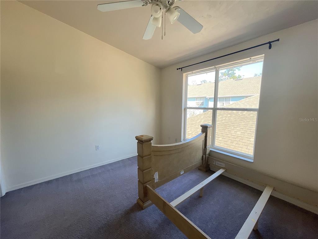 3930 Southwest 20th Avenue, Unit 1902 Gainesville, FL 32607 - Photo 8 of 15 a living room with furniture and window