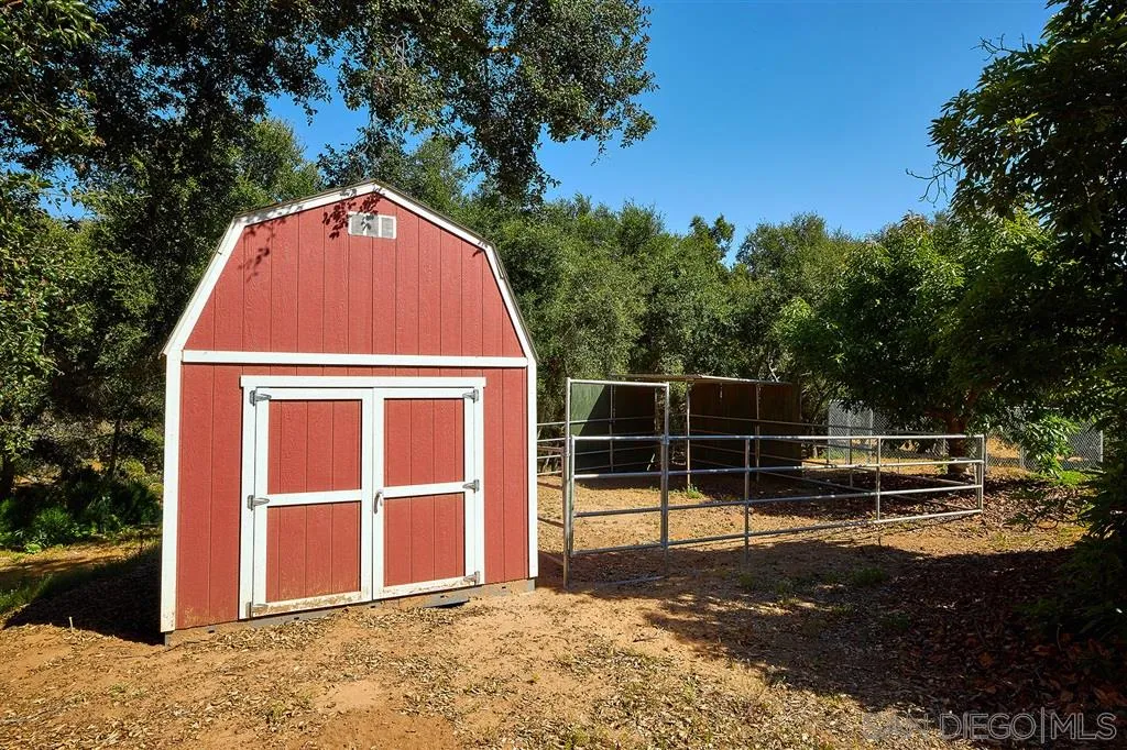 2255 Country Road Fallbrook, CA 92028 - Photo 19 of 24 a view of a wooden door with a yard