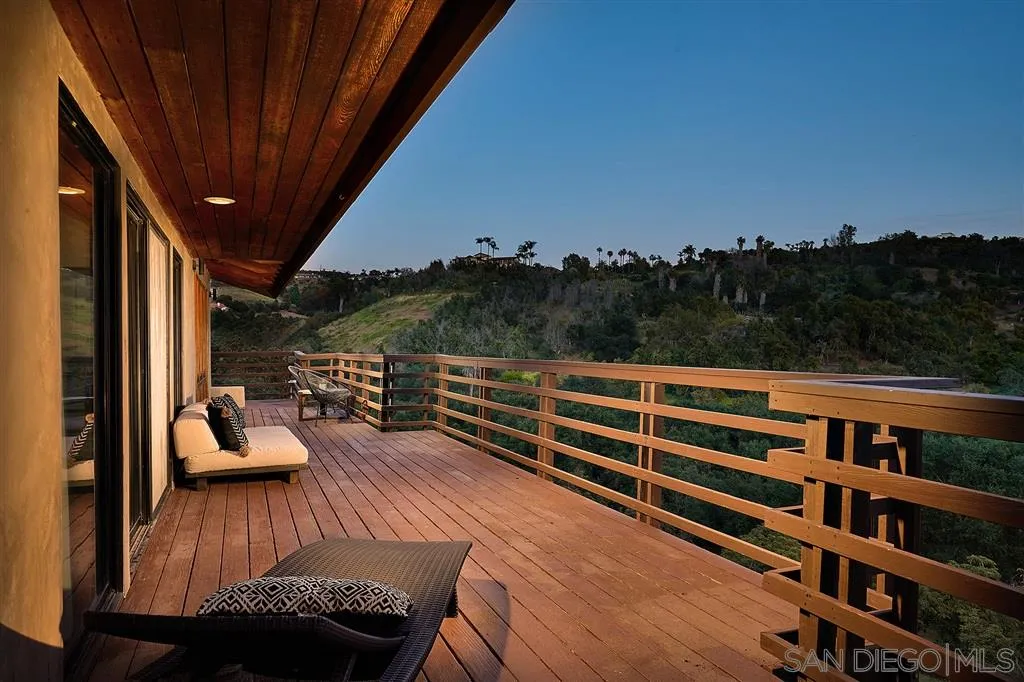 2255 Country Road Fallbrook, CA 92028 - Photo 3 of 24 a view of a balcony with couches and wooden floor