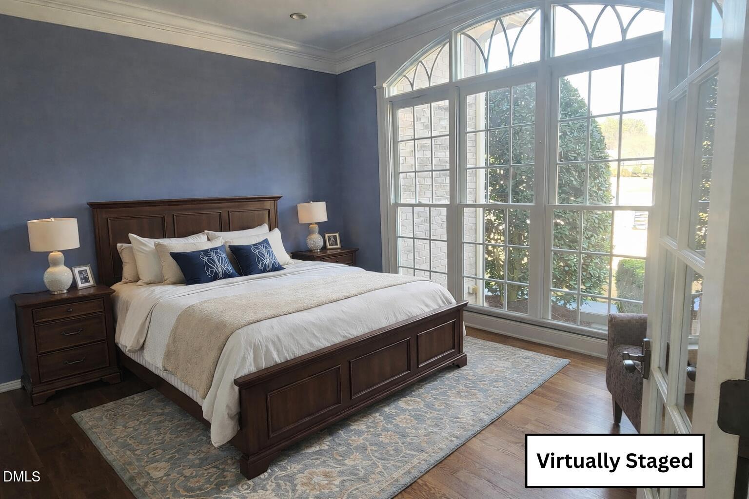 112 Winding Ridge Road Durham, NC 27713 - Photo 65 of 84 a bedroom with a large bed and a large window
