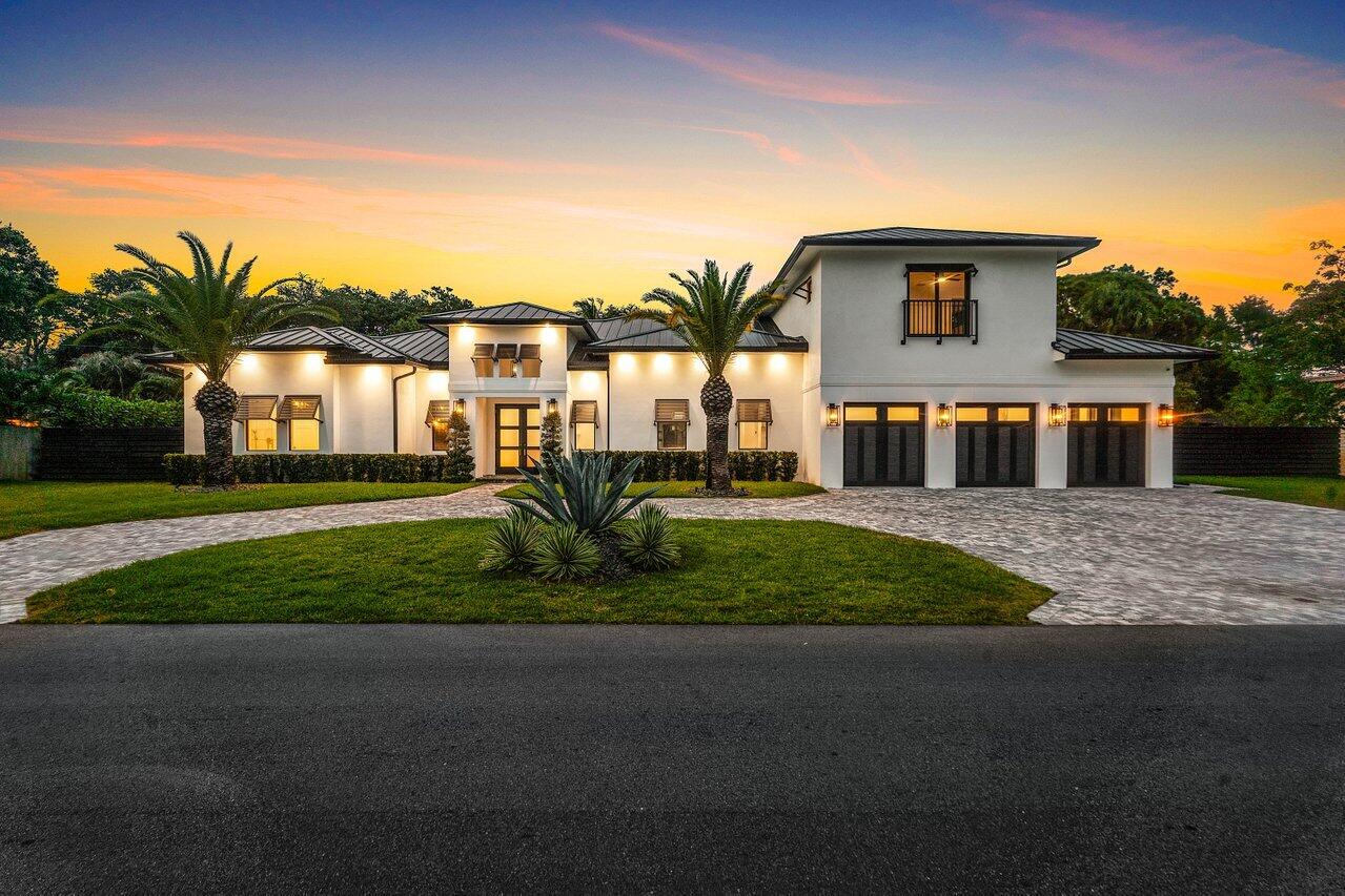 5701 Old Orange Road Jupiter, FL 33458 - Photo 46 of 46 a front view of a house with a yard and lake view