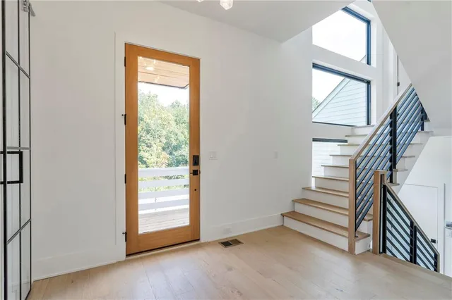 a living room with furniture and a lamp