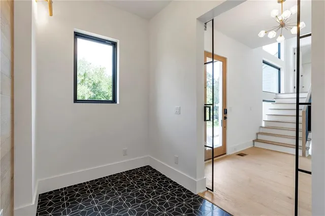 a kitchen with stainless steel appliances granite countertop a stove and a refrigerator