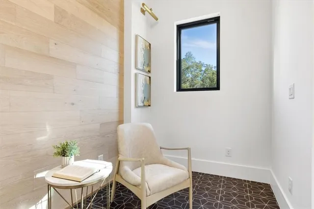 a living room with kitchen island furniture and a large window