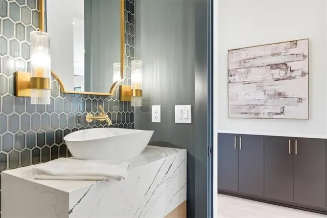 a dining room with wooden floor a glass table and chairs