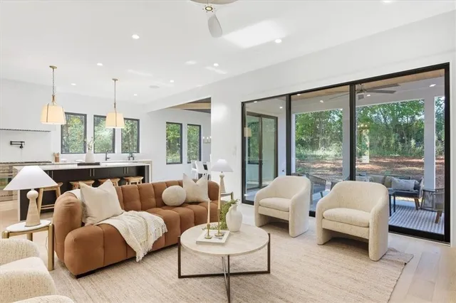 a bedroom with a large bed and a large window