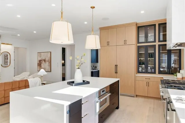 a view of an empty room with closet and a window