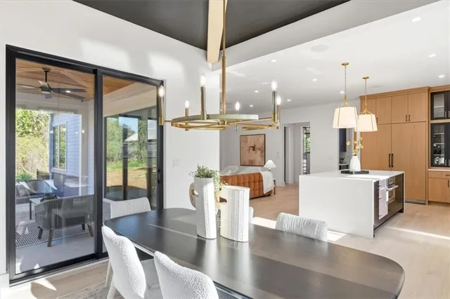 a bathroom with a toilet sink vanity and shower