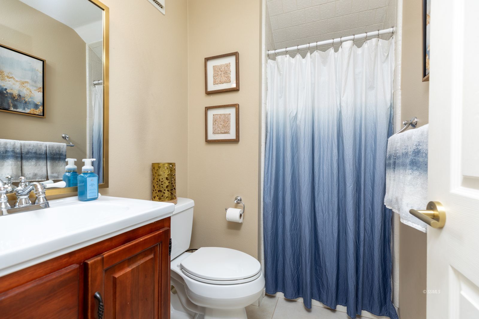 815 Hurschell Avenue Ridgecrest, CA 93555 - Photo 31 of 43 a bathroom with a sink a toilet and shower curtain