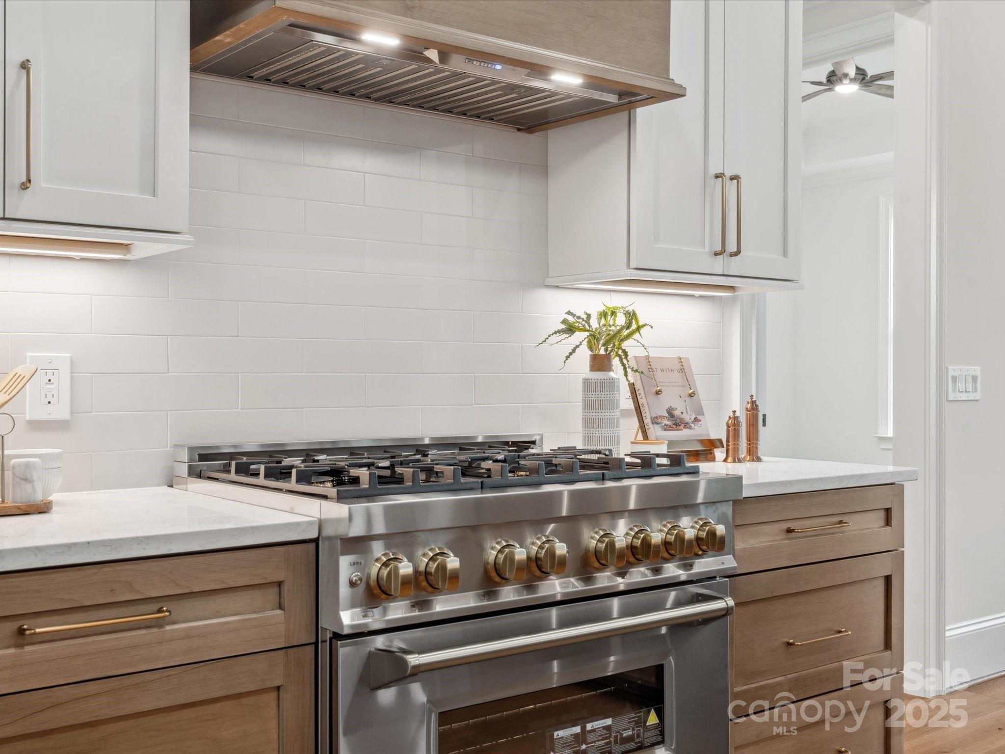 2024 Jumping Run Connelly Springs, NC 28612 - Photo 13 of 48 a stove top oven sitting inside of a kitchen