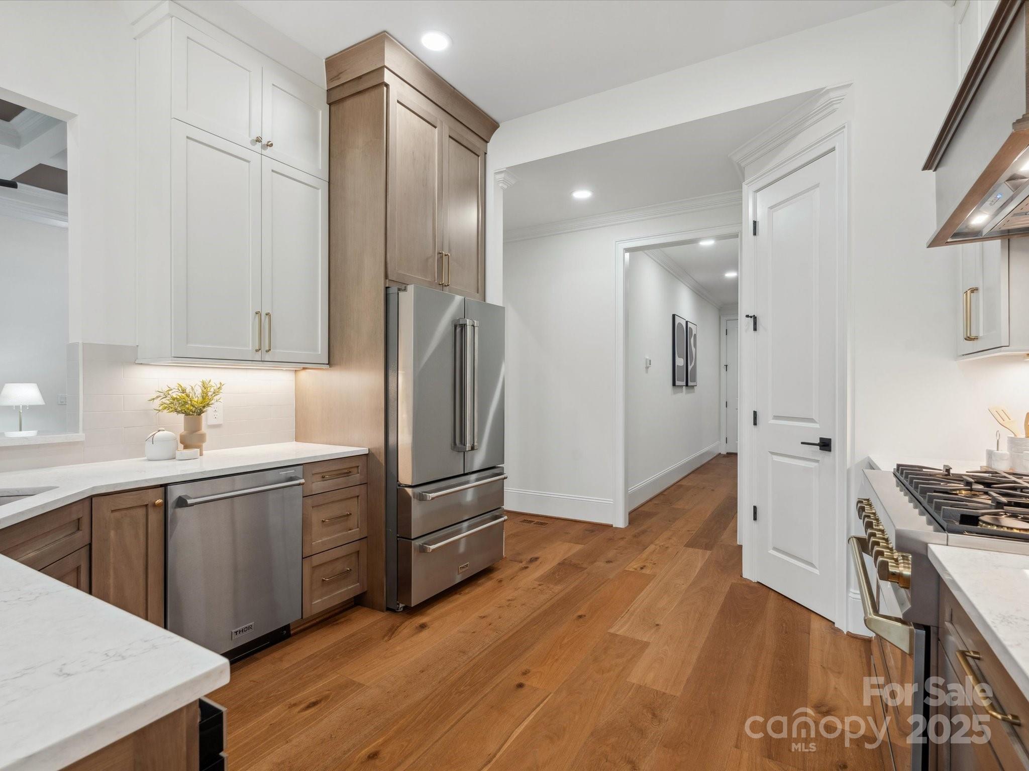 2024 Jumping Run Connelly Springs, NC 28612 - Photo 16 of 48 a kitchen with granite countertop a refrigerator and a sink