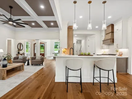a living room with furniture a table and chairs
