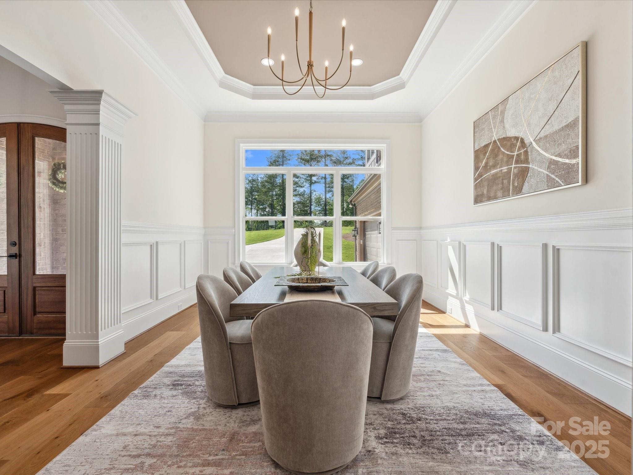 2024 Jumping Run Connelly Springs, NC 28612 - Photo 23 of 48 a dining room with chandelier and wooden floor