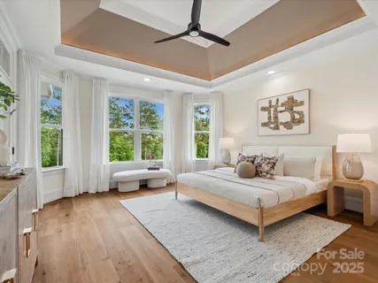 a bedroom with a large bed and a couch