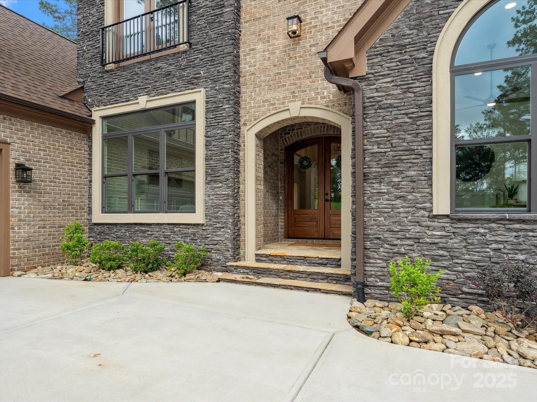 2024 Jumping Run Connelly Springs, NC 28612 - Photo 3 of 48 a front view of a house with a garden