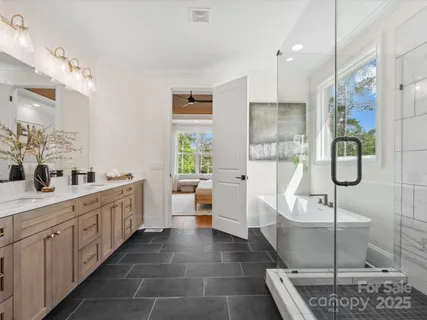 a large white kitchen with a large window
