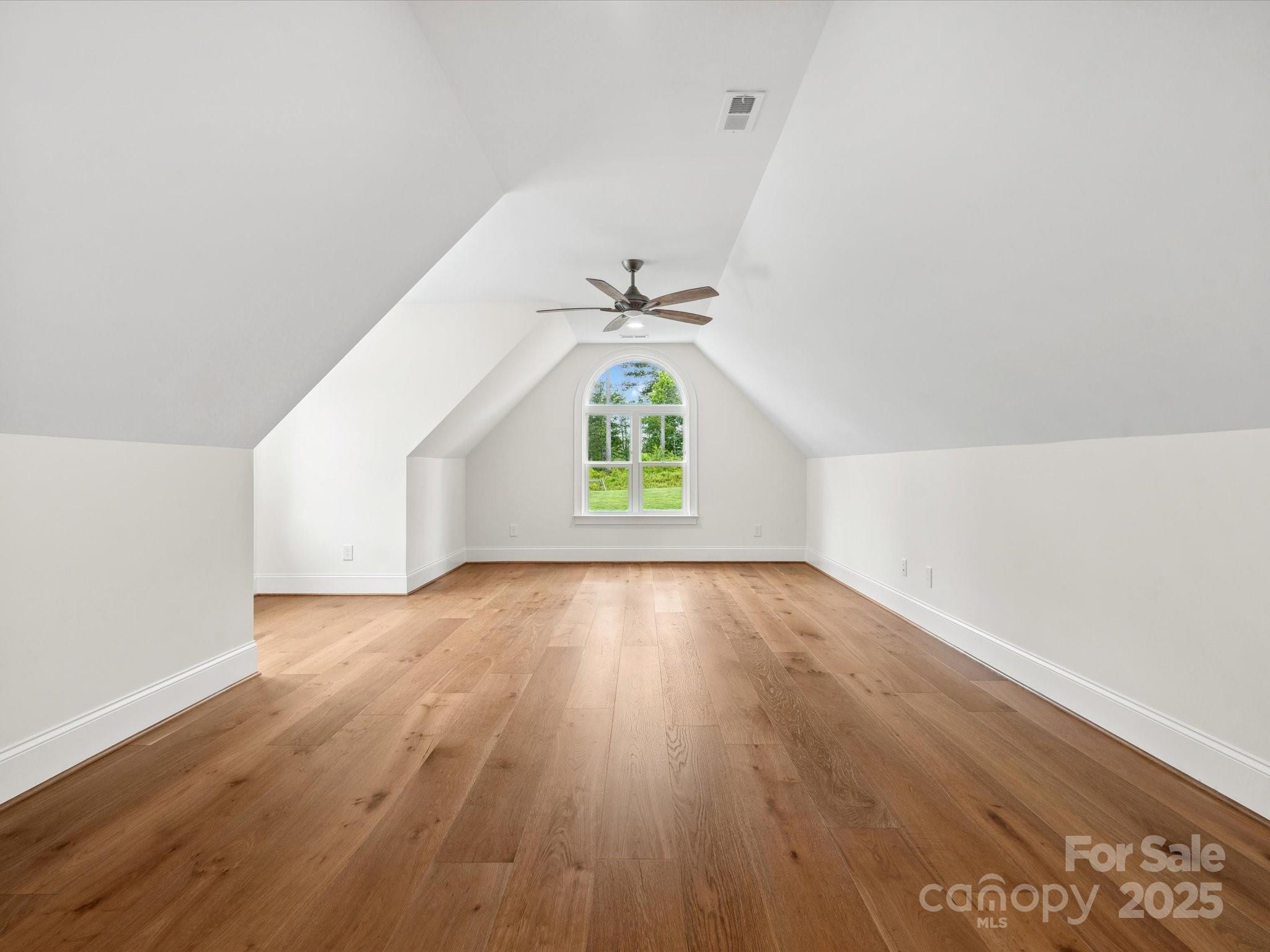 2024 Jumping Run Connelly Springs, NC 28612 - Photo 37 of 48 an empty room with wooden floor cabinet and windows