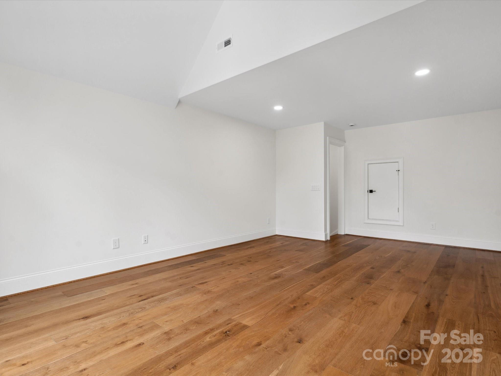 2024 Jumping Run Connelly Springs, NC 28612 - Photo 38 of 48 a view of empty room with wooden floor