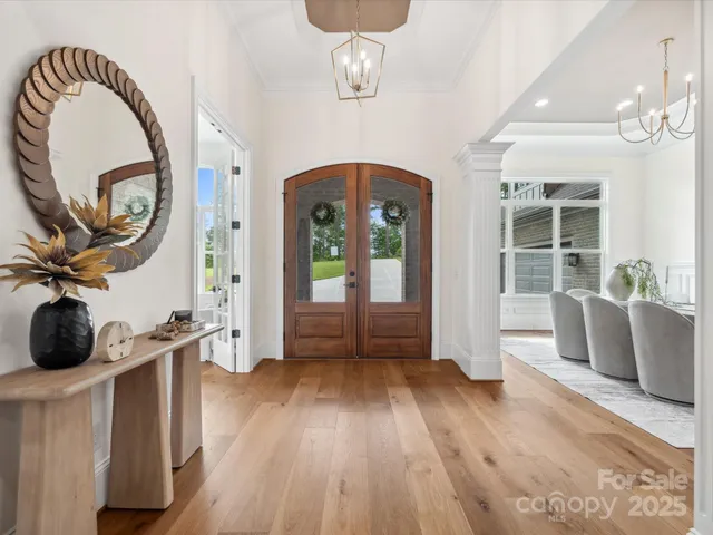 a view of a livingroom with furniture and hardwood floor
