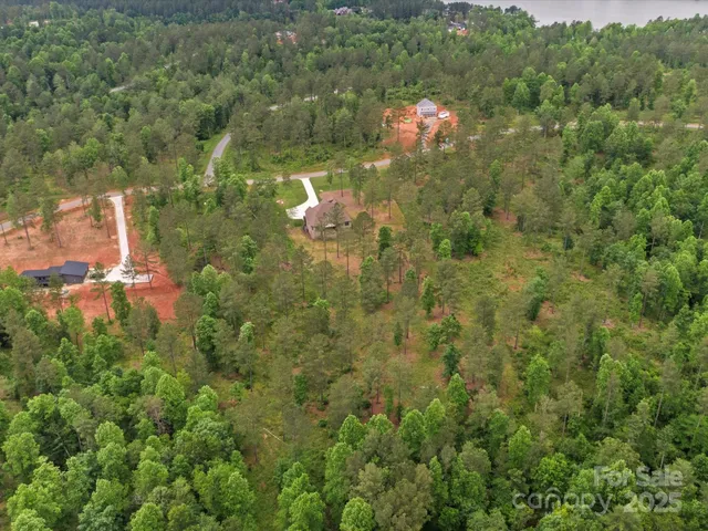 a view of a yard and basketball court