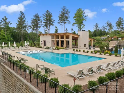 a view of a swimming pool with an outdoor seating