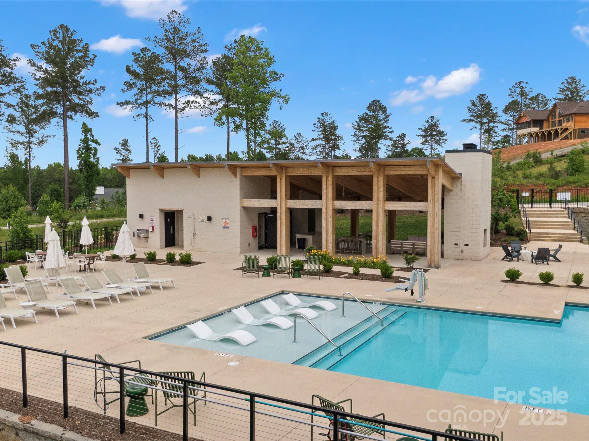 2024 Jumping Run Connelly Springs, NC 28612 - Photo 47 of 48 a view of a house with backyard and sitting area