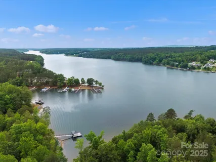 a view of a lake with houses in the back