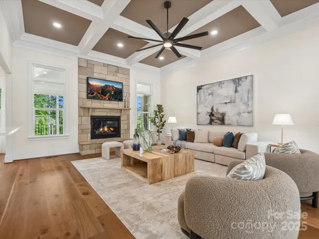a living room with furniture fireplace and a flat screen tv