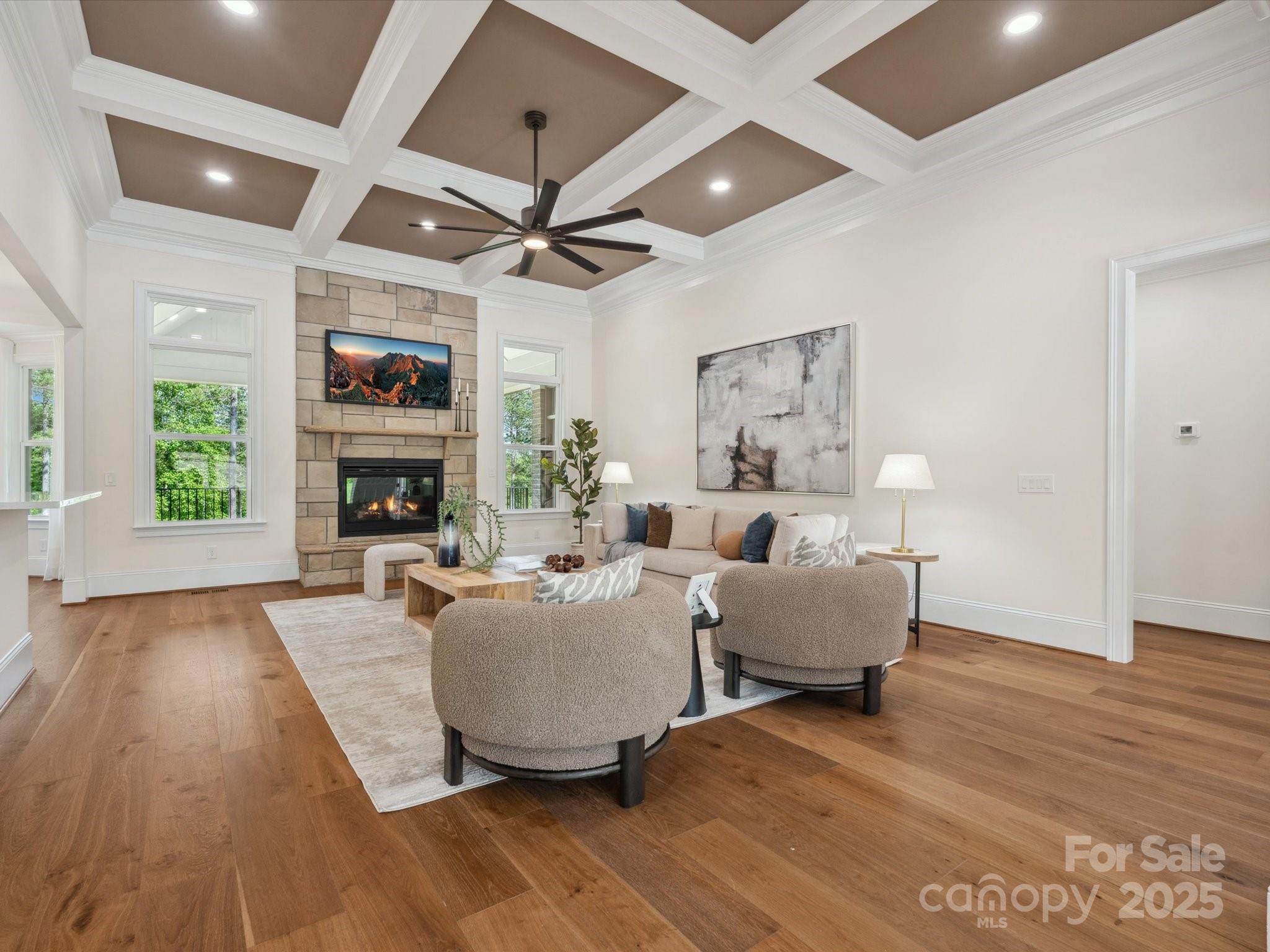 2024 Jumping Run Connelly Springs, NC 28612 - Photo 9 of 48 a living room with furniture a fireplace and a flat screen tv