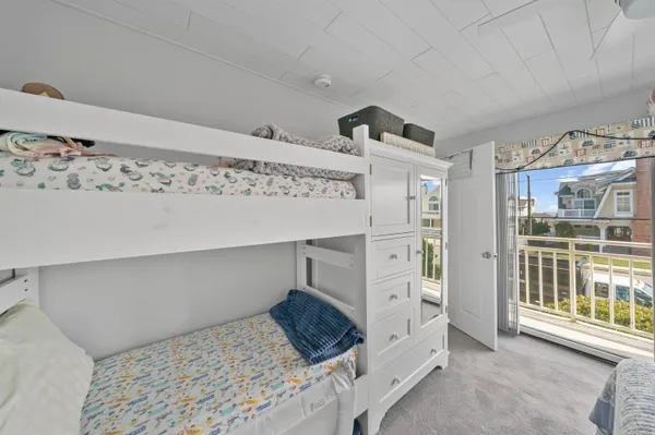 a bedroom with a bed and a view of bedroom