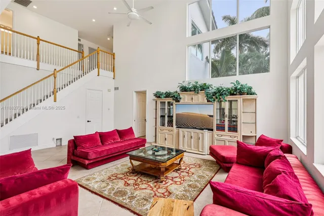 a bedroom with a bed a couch and a window