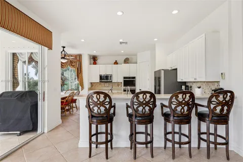 a bathroom with a sink vanity and a mirror
