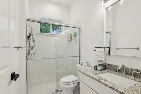 a view of staircase with white walls and windows