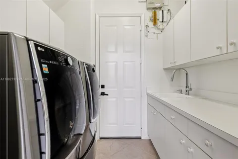 a white toilet sitting next to a white walls